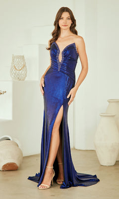 Woman wearing a navy blue evening gown with a high slit in a minimalistic setting