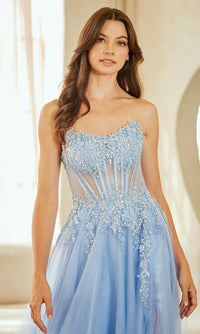 Woman wearing a light blue evening gown with intricate detailing