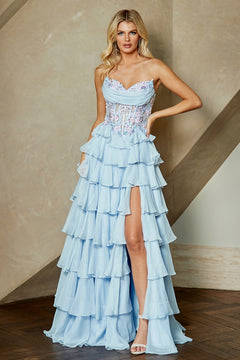 Amelia Couture 9103 strapless light blue tiered ruffled chiffon gown with a beaded corset bodice, floral embroidery, and a high leg slit.