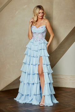 Amelia Couture 9103 strapless light blue tiered ruffled gown with a beaded corset bodice, sheer floral detailing, and a high leg slit.