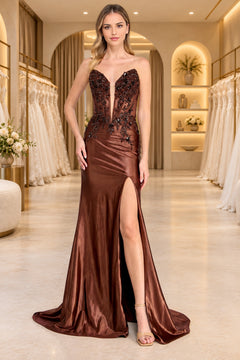 Amelia Couture 9107 strapless brown floor-length gown featuring a plunging corset bodice with sequin appliques, a deep V-neckline, and a high leg slit.
