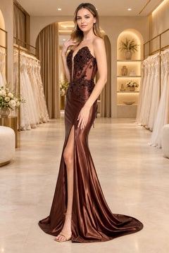 Amelia Couture 9107 strapless brown floor-length sweetheart prom dress with a beaded, plunging corset-style bodice and a high leg slit.