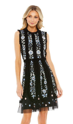 A woman stands against a white background wearing the Mac Duggal 9135 Embroidered Short Party Dress—a sleeveless black cocktail dress with intricate blue and white floral embroidery.