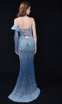 A woman stands elegantly against a black background in the Nina Canacci 9149, a sparkly, form-fitting long formal dress featuring an asymmetrical sleeve, lace-up open back, and flowing train.