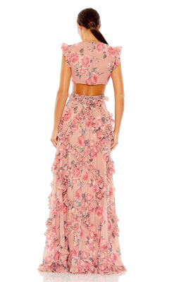A woman faces away in the Mac Duggal 9152, a floor-length pink floral gown with ruffles, matching crop top, cap sleeves, and fitted waist. The open back showcases her low ponytail for an elegant finish.