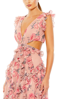 A woman models the Mac Duggal 9152 long formal evening gown—sleeveless, deep V-neck, pink floral print with ruffles, side cutouts, and an open back—against a plain white background.