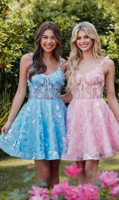 Two young women smile and pose in a garden, one wearing the Sheer-Corset Short Butterfly Hoco Dress JT917A and the other in a pink lace short A-line party dress, surrounded by lush greenery.