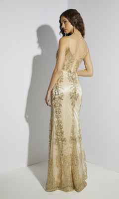 A woman stands facing away in a floor-length gold Long Glitter Jersey Prom Dress, Eureka 9188, featuring sheer panels and intricate embroidery, set against a minimalist white background.