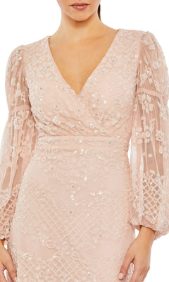A woman wears the Long Formal Dress 9197 by Mac Duggal, featuring blush pink color, long sleeves, floor-length cut, floral embroidery, sequin details, and a V-neckline.