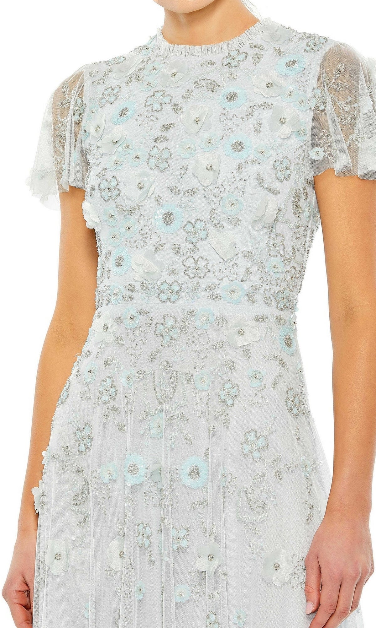 A woman wears the Mac Duggal 9212 Floral Midi Wedding-Guest Dress in light blue, featuring short sleeves, sheer fabric, and intricate floral embroidery.
