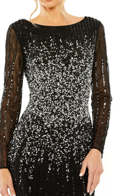 A person models the Mac Duggal 9226 Long Sleeve Sequin Formal Gown, which features silver sequin embellishments and sheer sleeves, shown from shoulders to hips.