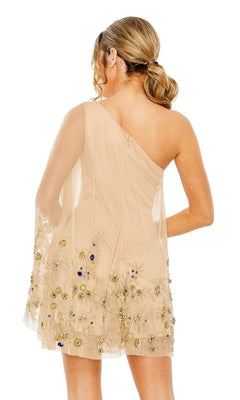Woman wearing the Mac Duggal Short Homecoming Dress 9231, featuring a one-shoulder design with floral beading and a sheer overlay, posing with her back to the camera in an elegant beige mini silhouette.