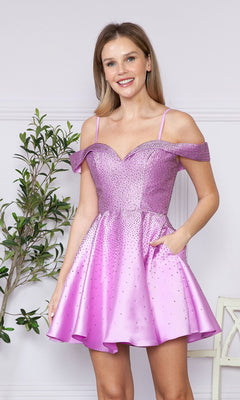 A woman stands indoors by a potted plant wearing the Beaded Off-the-Shoulder Short Party Dress 9238 in lavender, featuring sparkly embellishments.
