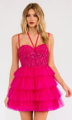 A woman wears the Sheer-Corset Short Ruffled Hoco Dress JT923S—a bright pink dress with a tulle A-line skirt, fitted embroidered corset bodice, and spaghetti straps—against a plain light background.
