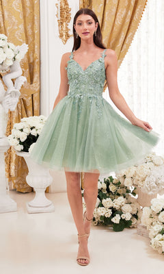 A woman wears the Metallic-Lace Short A-Line Homecoming Dress 9245, a light green, knee-length, sleeveless dress with floral details, standing indoors among white flowers and gold curtains.