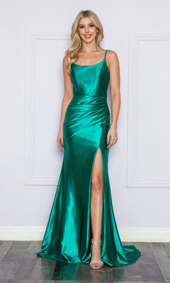 A woman wears the Strappy-Back Long Formal Prom Dress 9250—a sleeveless, floor-length emerald green satin gown with a thigh-high slit—standing against a light-colored wall.