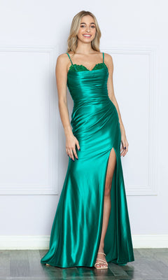 A woman wears the Long Sweetheart Ruched Prom Dress 9254—an emerald green satin gown with spaghetti straps, lace bodice detail, and a thigh-high slit—perfect for formal events.