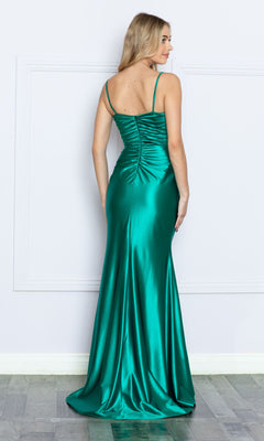 A woman faces away, wearing the Long Sweetheart Ruched Prom Dress 9254—an emerald green gown with a slit and ruched back, perfect as a formal dress under $150—standing against a plain white wall.