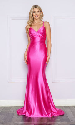 A woman poses against a light wall wearing the Empire-Waist Long V-Neck Mermaid Prom Dress 9256—a floor-length, fitted bright pink gown with thin straps.