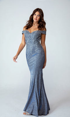 A woman stands against a plain light background wearing the Off-Shoulder Long Glitter Prom Dress Eureka 9306—a fitted, sparkly blue evening gown with a slight mermaid silhouette.