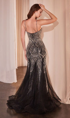 A woman poses with her back to the camera, wearing the Ladivine 9317 Long Black Beaded Prom Dress, featuring sheer accents and silver detailing, in a room with white curtains.