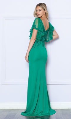 A woman stands against a light-colored wall wearing the Flutter-Sleeve Embellished Long Formal Dress 9318, a floor-length green gown with fitted silhouette and lace ruffle detailing on the upper bodice.