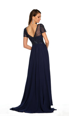A woman stands facing away against a plain white background, wearing the Long Formal Dress A9322 by Dave and Johnny—a navy blue, floor-length gown with a beaded short-sleeve bodice and deep V-back.