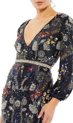 A woman wearing the Mac Duggal Long Formal Dress 93546 featuring a deep V-neck, long sleeves, and intricate multicolored sequin and bead floral embroidery.