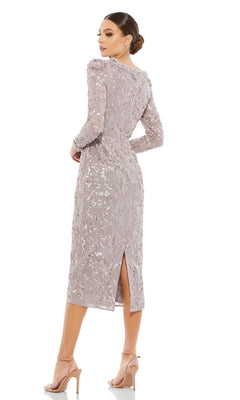 A woman wears the Sequin Midi Wedding Guest Dress: Mac Duggal 93595, featuring long sleeves, sequins, a back slit, and nude heels against a white background—an elegant option for wedding guests.