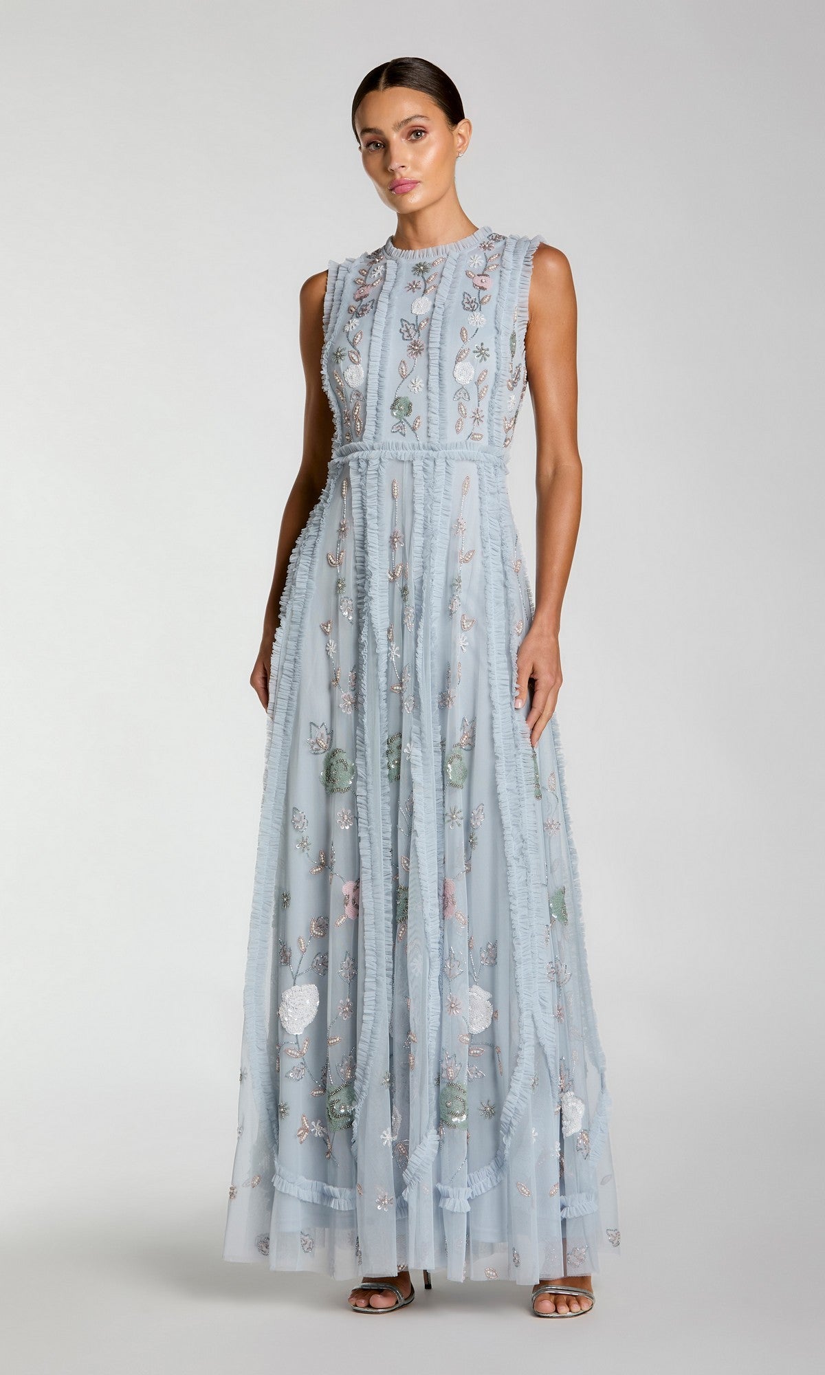Woman wearing the Sleeveless Long Sage Formal Dress: Mac Duggal 9360, a floor-length sage gown with floral embroidery, standing against a plain background.