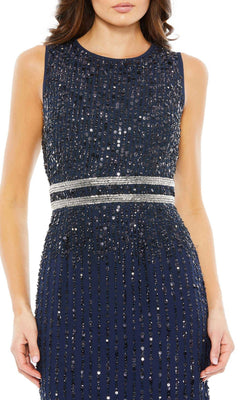A woman wears the Sleeveless Sequin Formal Dress: Mac Duggal 93603, a navy blue gown with sequins and a silver embellished waistband, perfect for formal evenings.