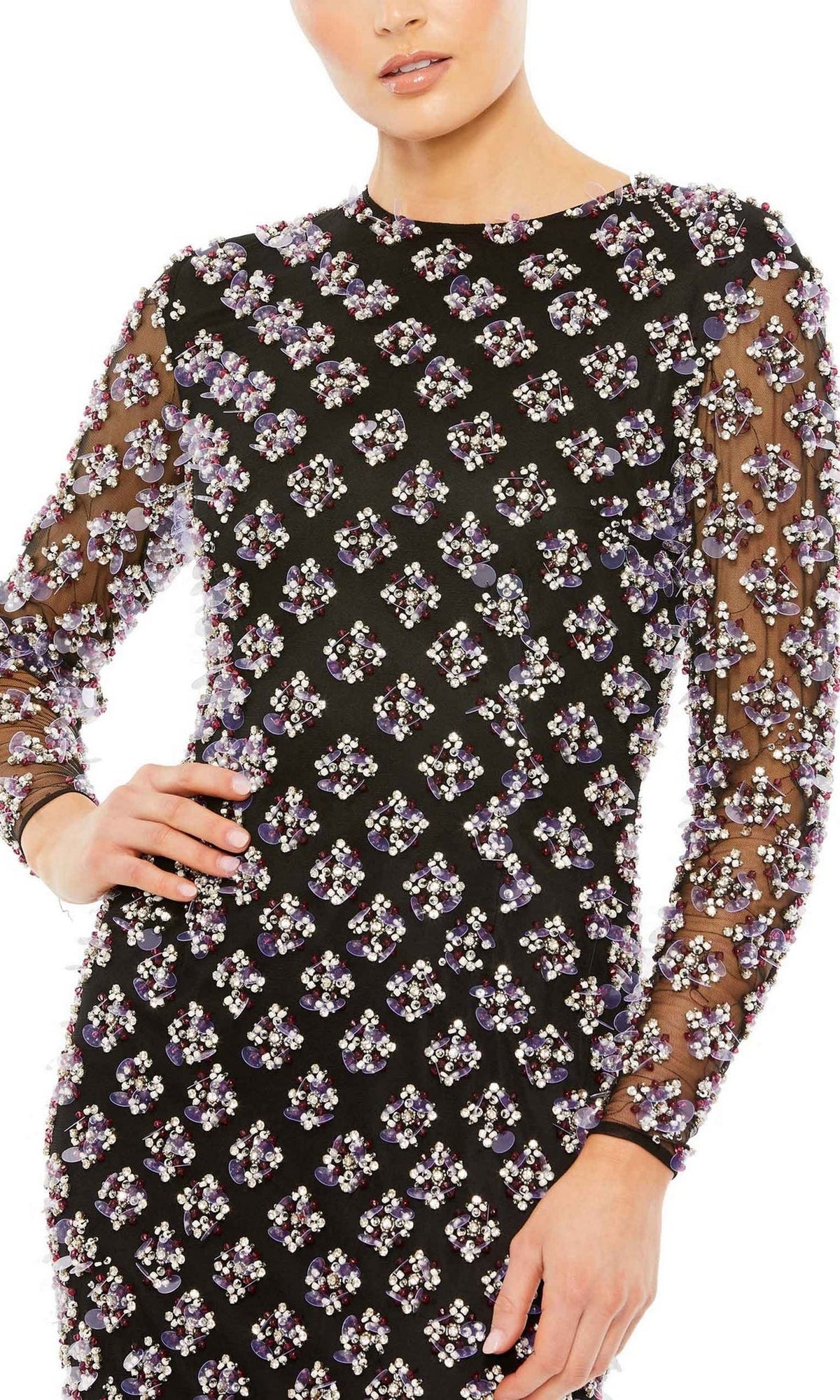 A person wearing the Long Formal Dress 93618 by Mac Duggal, a black formal long sleeve gown with a sheer overlay and purple and silver floral grid embellishments, creates an elegant look perfect for formal events.