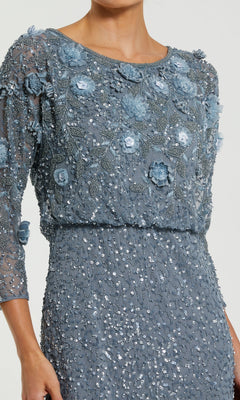 A woman wearing the Mac Duggal 9373 Tea-Length Wedding Guest Dress, featuring blue three-quarter sleeves, exquisite floral embroidery and sequin embellishments, with delicate 3D floral accents on a light background.