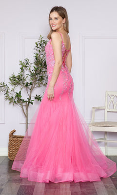 A woman stands indoors, smiling over her shoulder in the Sheer-Corset-Bodice Long Mermaid Prom Dress 9374—a floor-length pink gown with lace-up back and delicate floral embroidery.