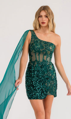 A woman wears the Sash Short Sequin Homecoming Dress Juliet JT937R, a dark green one-shoulder dress featuring sequins, embroidery, a sheer panel, and a flowing chiffon sleeve.