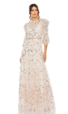 A woman wears the Modest Long Sleeve Formal Dress: Mac Duggal 93805, an embellished evening gown with floral appliqués, sequins, fitted waist, and three-quarter sleeves.