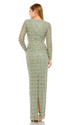 A woman faces away, wearing the Long Formal Dress 93827 by Mac Duggal—a light green, beaded gown with long sleeves, floor-length fitted silhouette, intricate beadwork, back slit, and high-heeled shoes.