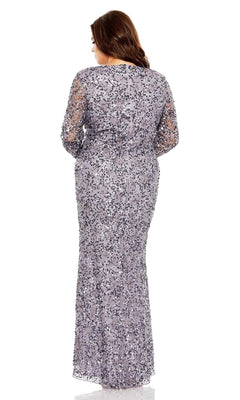 A woman stands with her back to the camera against a white background, wearing the Long Plus-Size Prom Dress 93865 by Mac Duggal, featuring vintage sequins and sheer sleeves.