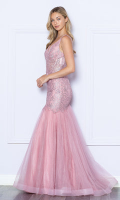 A woman stands against a white wall wearing the Low V-Neck Long Glitter Mermaid Prom Dress 9388, a sleeveless, floor-length pink gown with lace and tulle detailing.