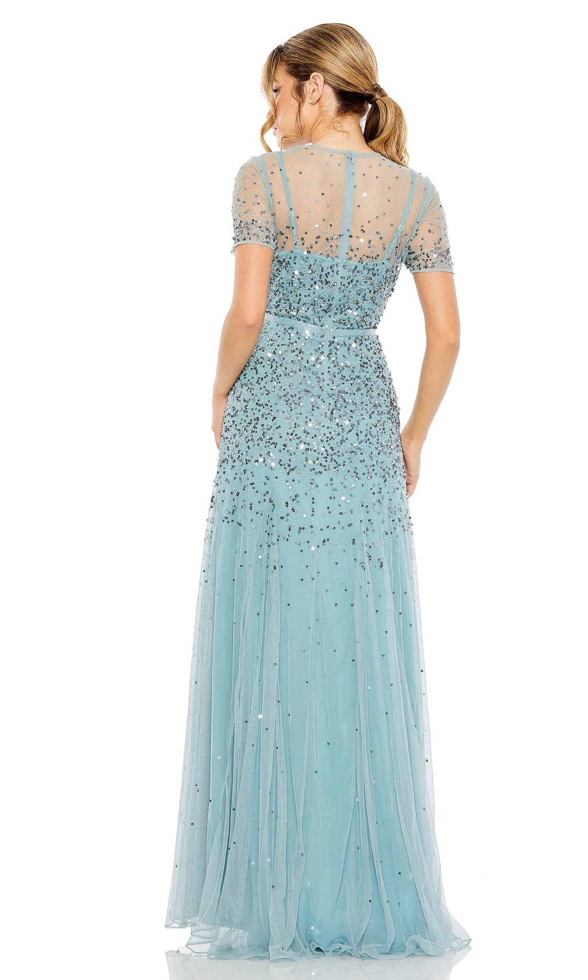 Woman shown from the back in the Mac Duggal Sheer High-Neck Sequin Formal Dress 93909, a floor-length light blue A-line gown with short sheer sleeves and beaded waist embellishments.