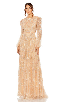 A woman stands facing forward in a sheer peach long sleeve beaded formal gown, featuring intricate floral embroidery and puffed sleeves—similar to the Mac Duggal 93930.