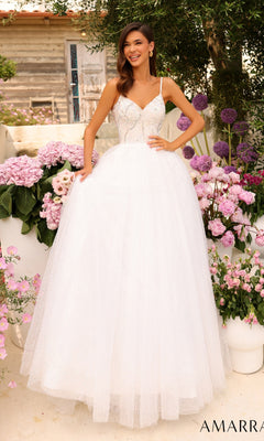 A woman smiles outdoors among pink and purple flowers, wearing the Amarra Sequin-Bodice Long A-Line Prom Dress 94020, with one hand on her waist.