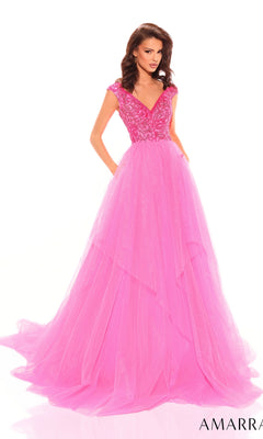 A woman wearing the Beaded-Bodice Long A-Line Prom Dress: Amarra 94038, a bright pink, floor-length gown with a fitted embellished bodice and cap sleeves, stands against a white background.