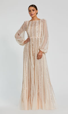 A woman models the Mac Duggal 94081, a long formal dress with sheer long sleeves and vertical sequin details in light beige, set against a plain background.