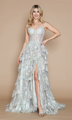 A woman stands against a plain beige background wearing the Sheer-Corset Long Ruffled Prom Dress: Poly USA 9410 in light blue, featuring a corset bodice and a thigh-high slit.