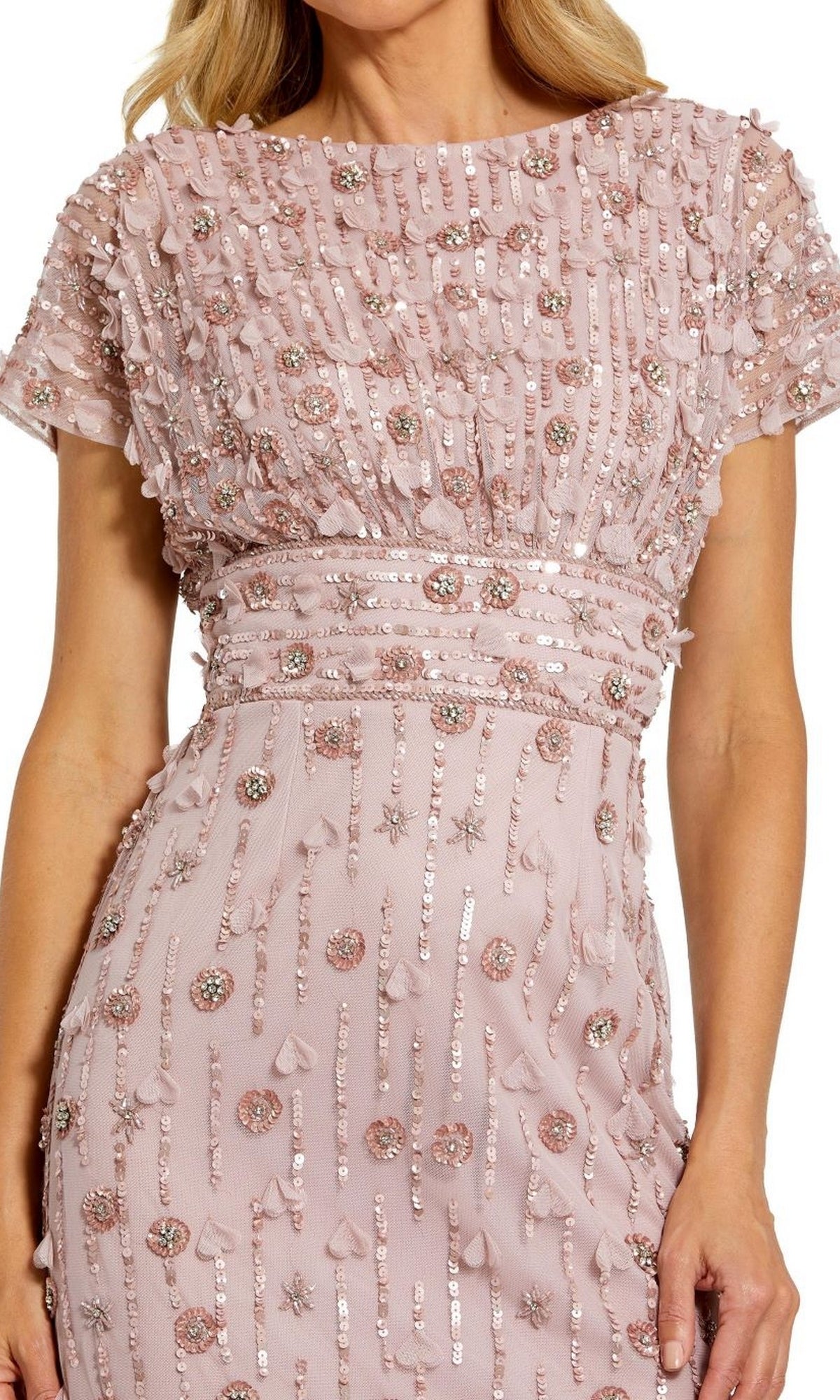 A woman wearing the Mac Duggal Beaded Midi Wedding-Guest Dress 94117—a light pink, short-sleeved dress with sequin stripes, beads, and textured geometric and floral embellishments.