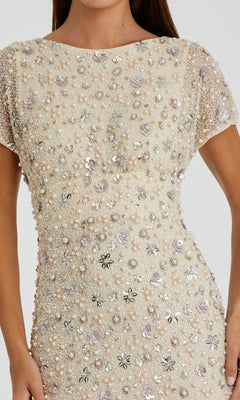 A close-up of a woman’s torso wearing the Mac Duggal 94205 Embellished Long Formal Dress, featuring short sleeves, cream beading, sequins, and floral details—ideal for any special occasion.