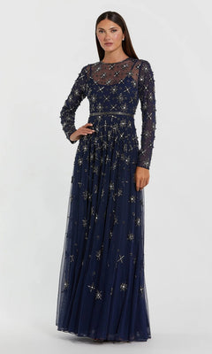 A woman wearing the Long Formal Dress: Mac Duggal 94216 in midnight—a floor-length gown featuring sheer long sleeves, intricate gold embroidery, and delicate beaded embellishments—poses against a plain, light background.