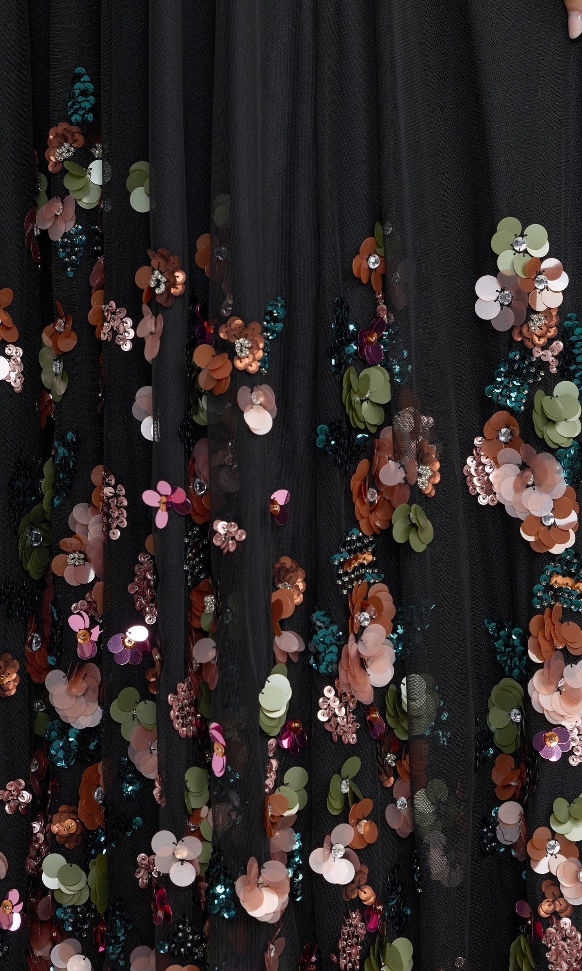 The Mac Duggal 94270 Long Formal Dress features black sheer fabric adorned with clusters of colorful sequins and 3D sequin flowers, showcasing delicate floral embellishments in shades of green, copper, pink, and teal—an elegant choice for a standout black mesh formal dress.