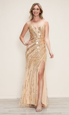 A woman in a champagne/gold Lace-Up Long Beaded Prom Dress (Poly USA 9438) with a corset bodice, thigh-high slit, and spaghetti straps pairs the gown with metallic heels against a plain light background.